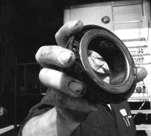 HE KNOWS THE SCORE:Brian Burrows, themaintenance manager at MacKinnon Transport, displays some of the bearing damage linked to early installation problems associated with semi-fluid grease. He prefers the use of oil in hubs.(File photo byJohn G. Smith)