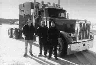 PETE PICKS: Barry Marchand (centre) of Frontier Peterbilt found model employees in Stuart Gregory (left) and Bert Downton. (Photo by Pat Rediger)