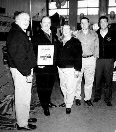 HAPPY 20TH: Cummins Alberta owners Ed and Paige Stahl collect a 20th anniversary plaque from Cummins' Ron Wilson (second from left), while Greg and Eddy Stahl look on. The anniversary was celebrated on April 29 by 1,490 guests - 80 of whom took the opportunity to road test trucks brought by participating heavy-truck dealers. Also on display were a series of Cummins-powered antique trucks, on loan from Ed Prodor of the American Truck Historical Society's Alberta chapter.
