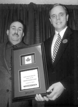 WINNING SMILE: Canadian Trucking Alliance/ Volvo Trucks Canada National Driver of the Year Barry Enman (left) receives his award fromBrent Weary, Volvo Trucks Canada vice-president, sales and marketing.