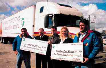 THANKS: Challenger's Dave Bennison, the Salvation Army's Neil Lewis, the OTA's David Bradley, the Red Cross' Tanya Elliot and Challenger's Beau Rose took part in the fleet group's official thank you ceremony. Both charitable groups took home $2,500 for helping truckers immediately after the Sept. 11 attacks.