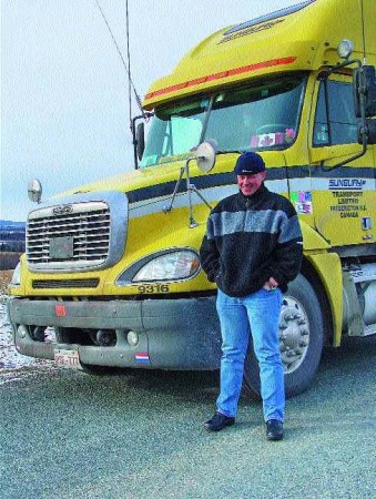 HAPPY IN CANADA: Dutch truck driver Harm Meulman says he loves his new life on Canada's highways. Photo by Annette Sluiter