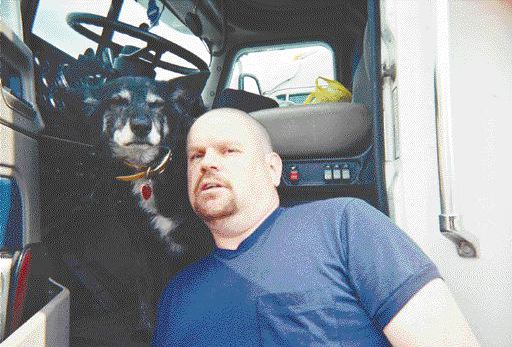 TRUCKER'S BEST FRIEND: Pepper and Keith Fullerton have been on the road for four years together.Photo by Adam Ledlow