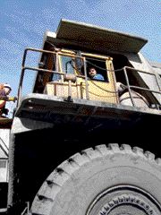 HIGH IN THE SADDLE: Driving the mine trucks can be intimidating at first, due to their size.Photo by Steven Macleod