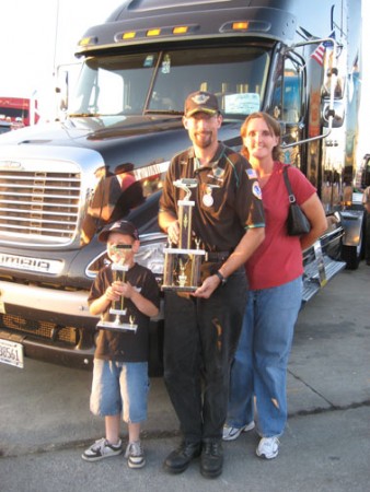 Matthew Slovak stands with his son, Nathan, and his wife, Candice, after winning the second annual Gary King Trucker Buddy trophy.