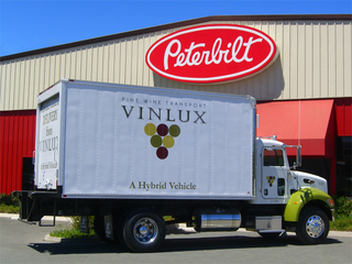 Peterbilt has delivered its first two production hybrids to a wine delivery company in Napa Valley.