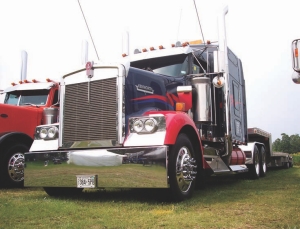 COOL KENWORTH: Tom Ellis's cool red and blue Kenworth was a winner twice over in the show'n'shine competition, taking first place in the Best Tractor/Trailer -Tandem -Float, Flat or Curtain-side category and second place in the Best '00 to '03 O/O Working Tractor category .