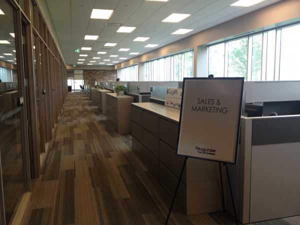 The cubicle and office layout of Trailcon's new facility in Brampton is accented with lots of natural light coming from the building's windows.