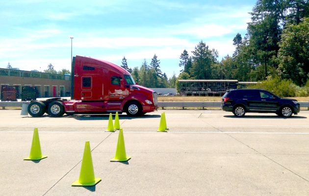 A Kenworth truck with Bendix Wingman Fusion automatically brakes to avoid a rear-end collision with a parked car.