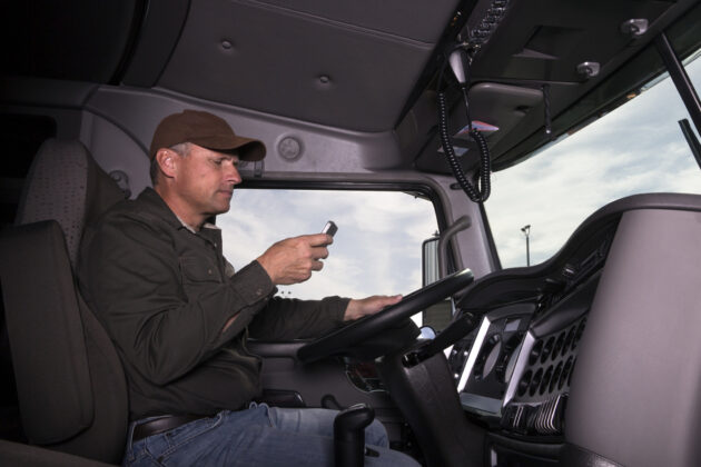 distracted truck driver with phone