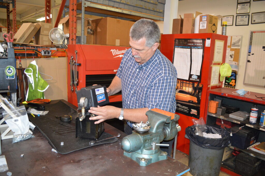 Mike Deckert displays an automated lubrication system at Flo Components in Mississauga, Ont. (Photo: Leo Barros)