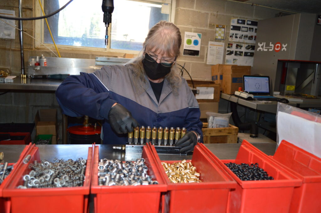 A worker assembles parts at Lubecore International in Campbellville, Ont. (Photo: Leo Barros)