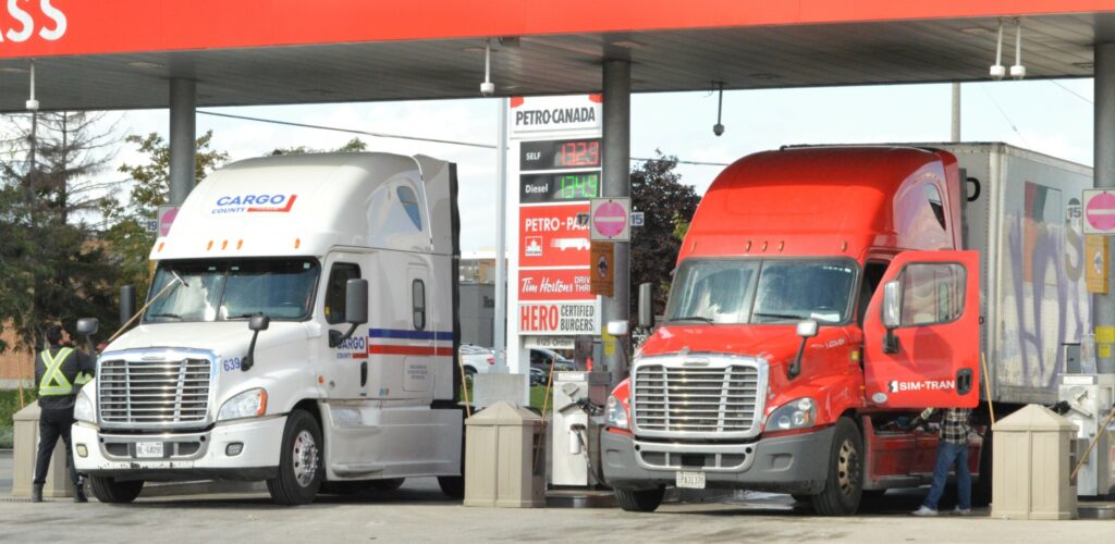 Picture of trucks fueling at a truck stop.
