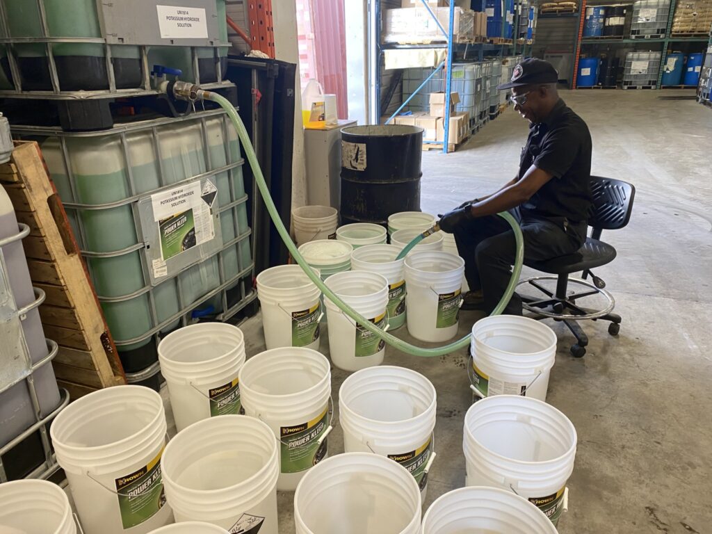 A worker fills a product into containers at Krown’s facility in Schomberg, Ont. (Photo: Leo Barros)