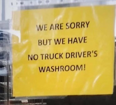 Picture of sign saying "we are sorry but we have no truck driver's washroom!"