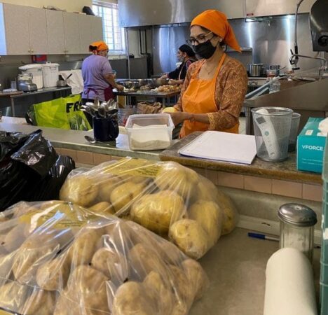 Volunteers prepare meals