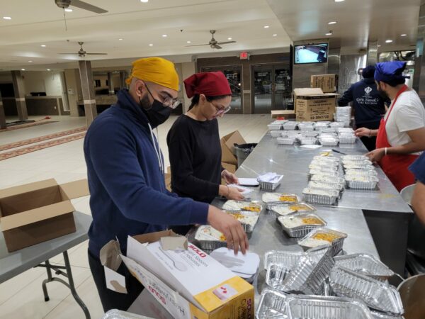Volunteers pack food