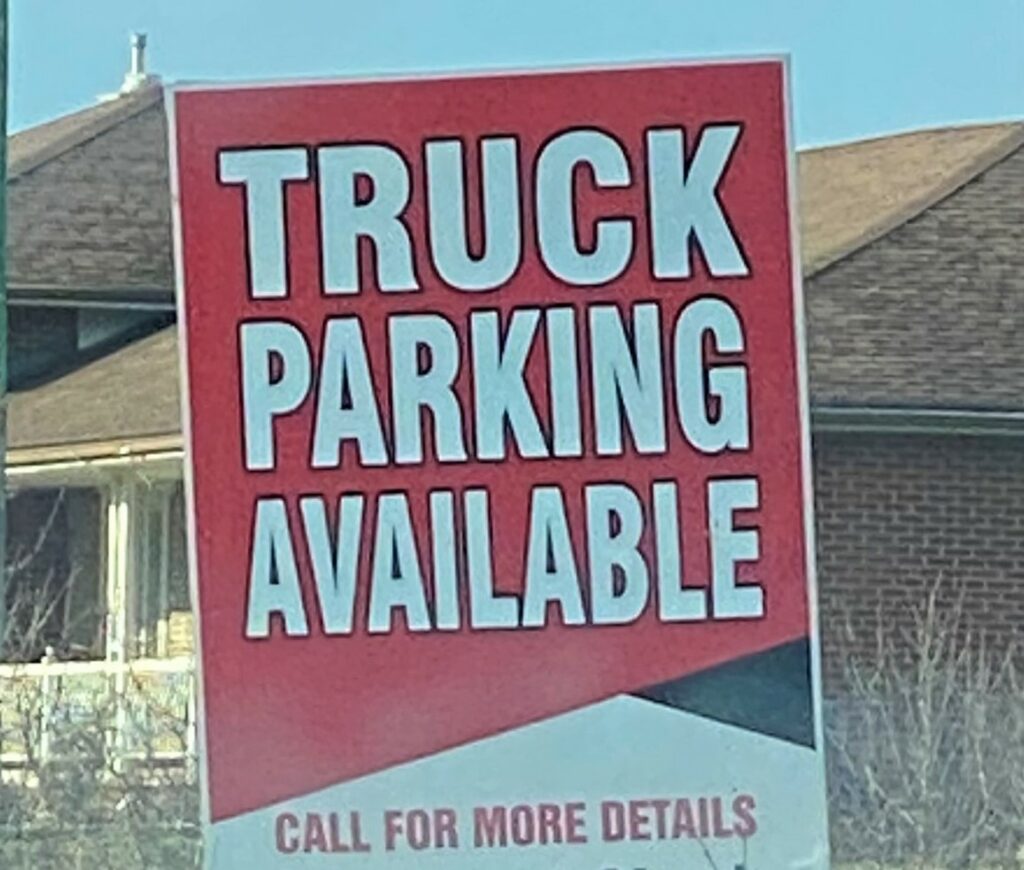 Sign advertising truck parking
