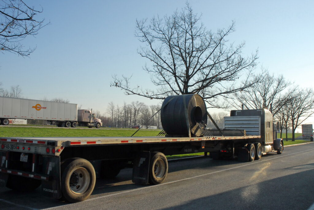 coiled steel on open deck trailer