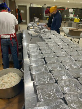 Volunteers pack meals