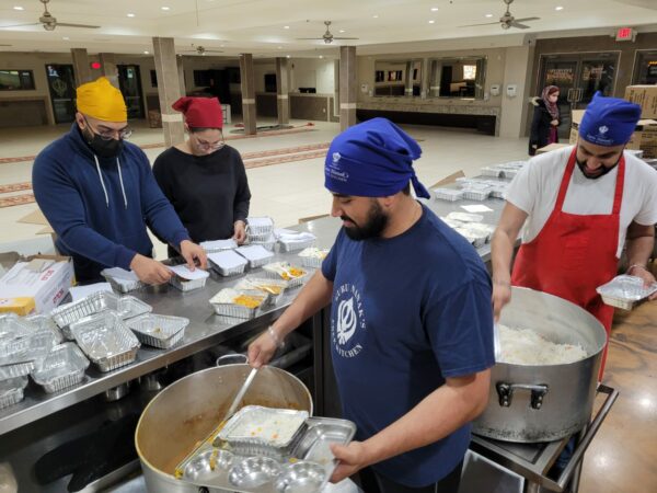 Volunteers pack meals
