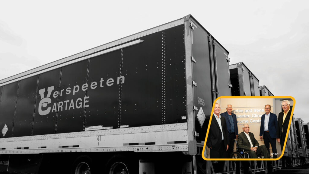 The Verspeeten family pictured with trucks