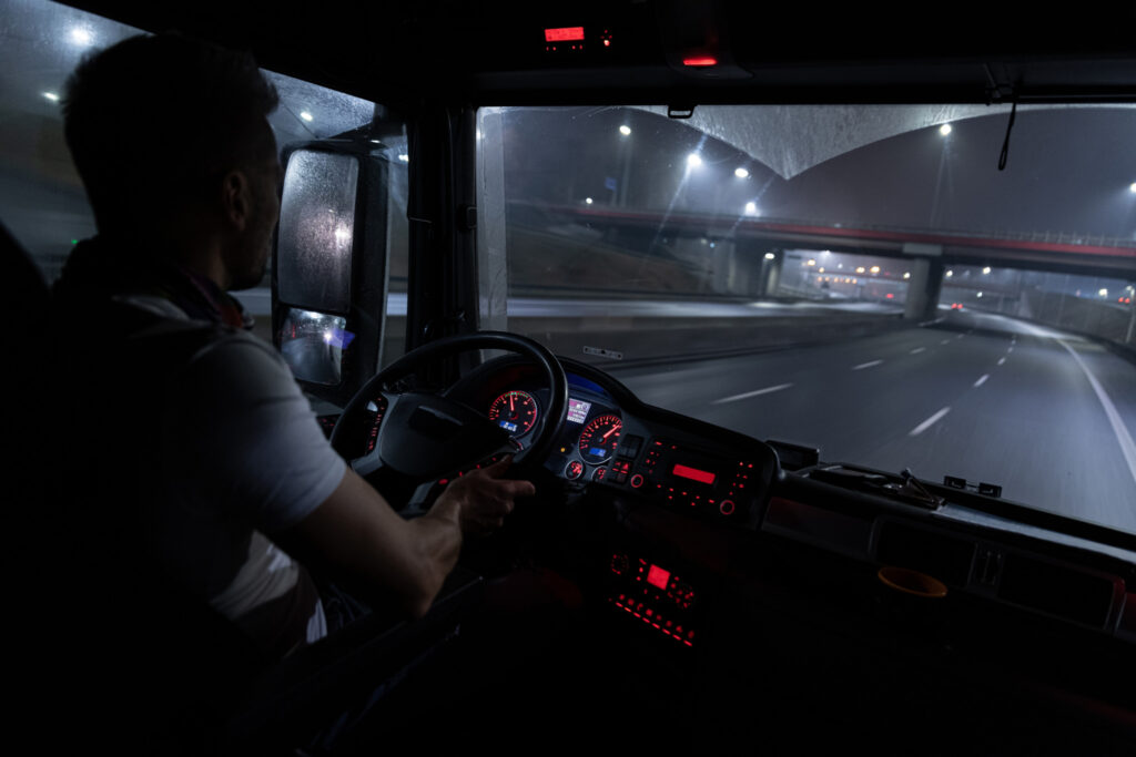 Driver behind the wheel at night