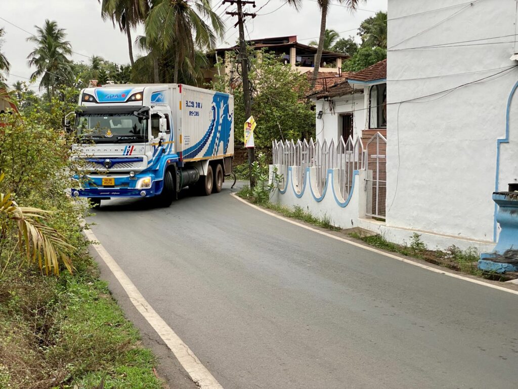 Truck takes a tight corner in Goa, India.