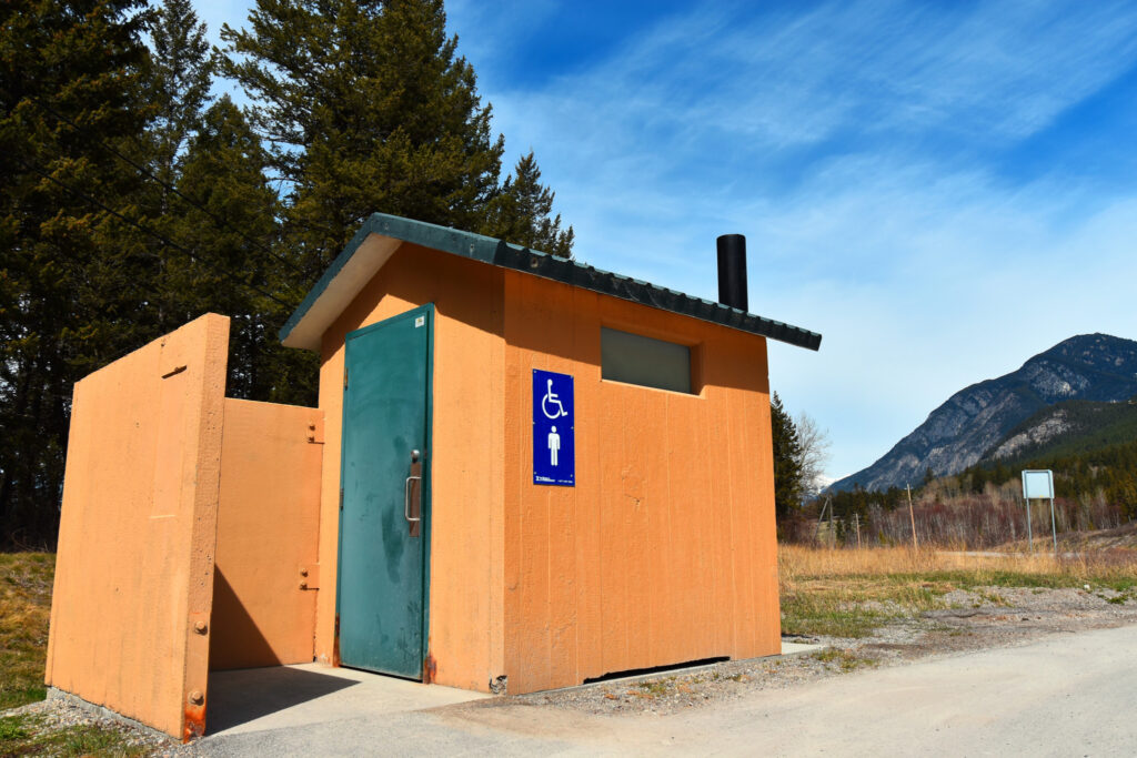 An image of an outdoor public toilet in a provincial park.