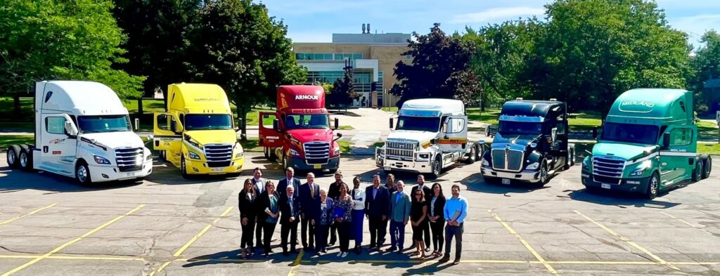 Picture of people standing in front of trucks