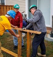Picture of people helping construct a home