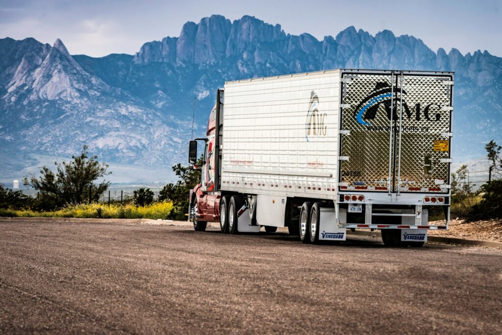 Truck parked with mountains in the background