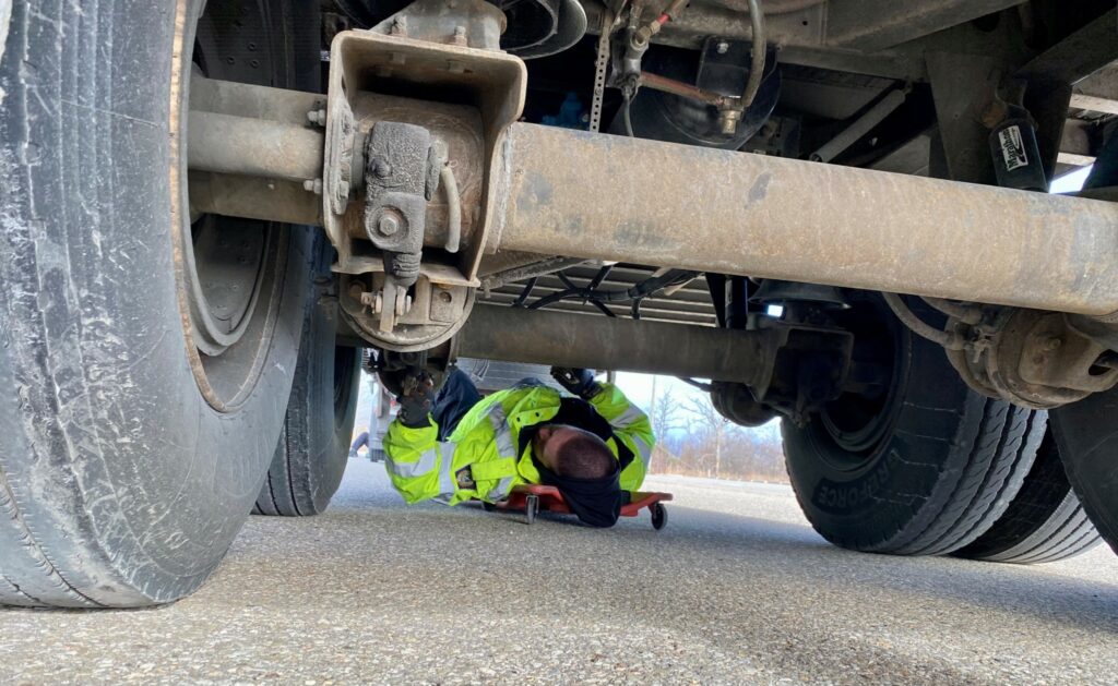 Picture of officer inspecting a truck