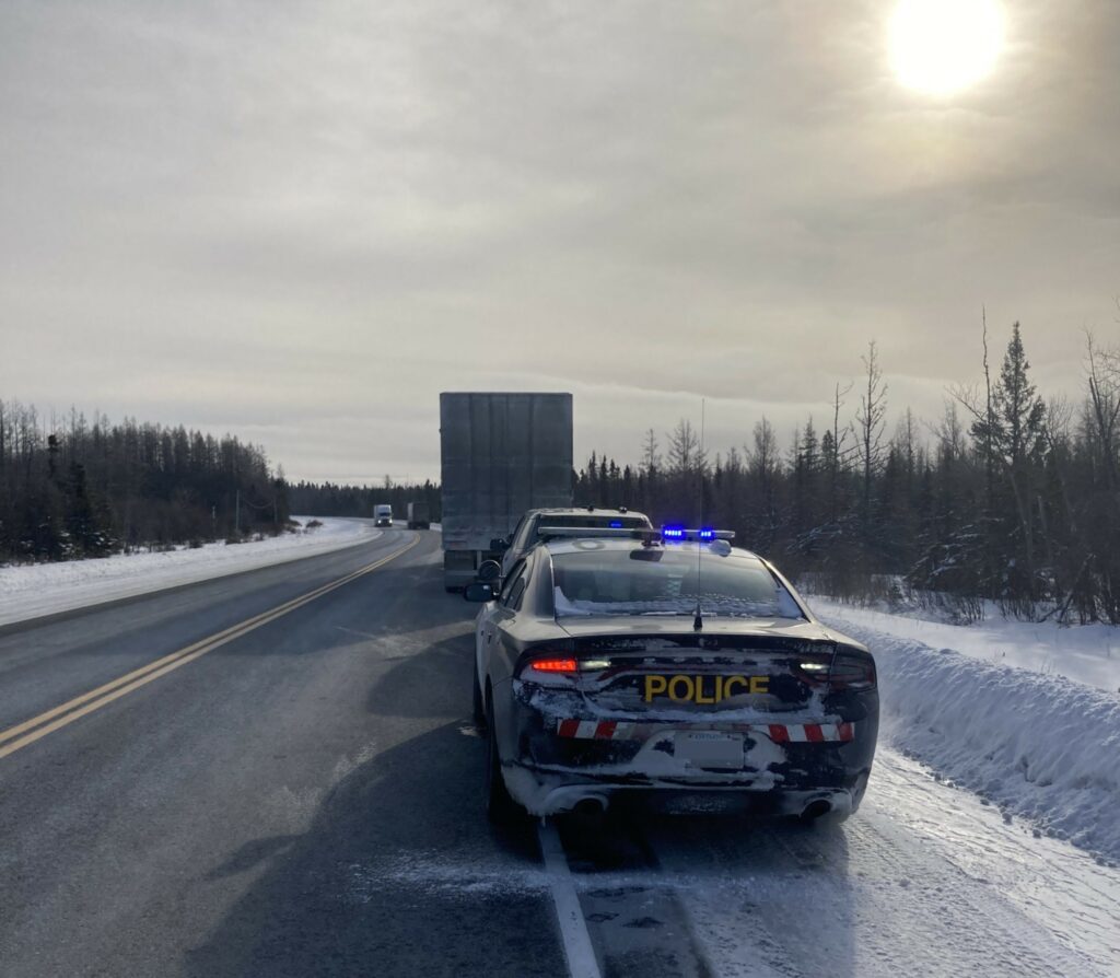 Picture of an OPP cruiser and a truck pulled over on Highway 11 in Ontario