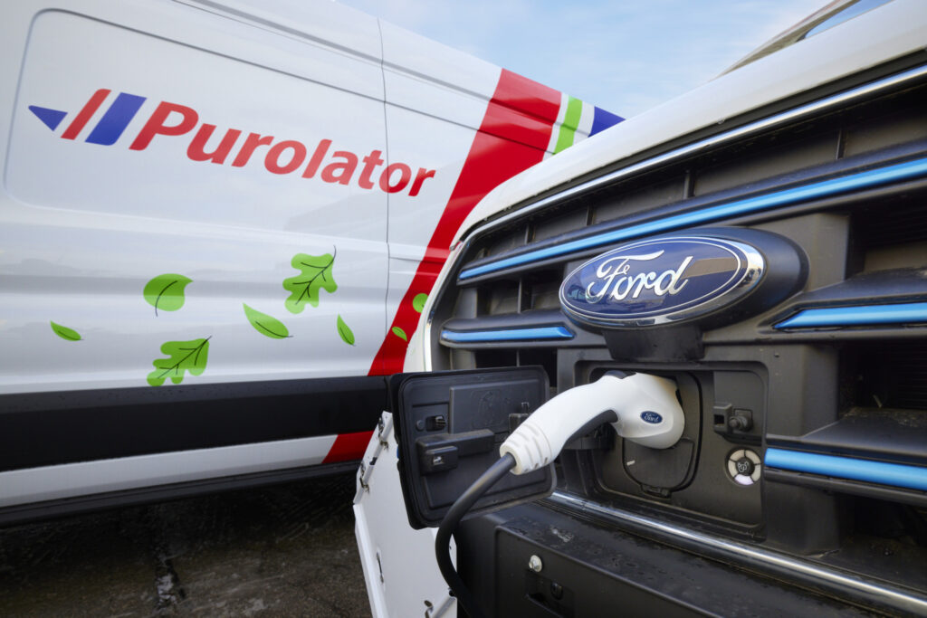 A Purolator electric vehicle being charged.