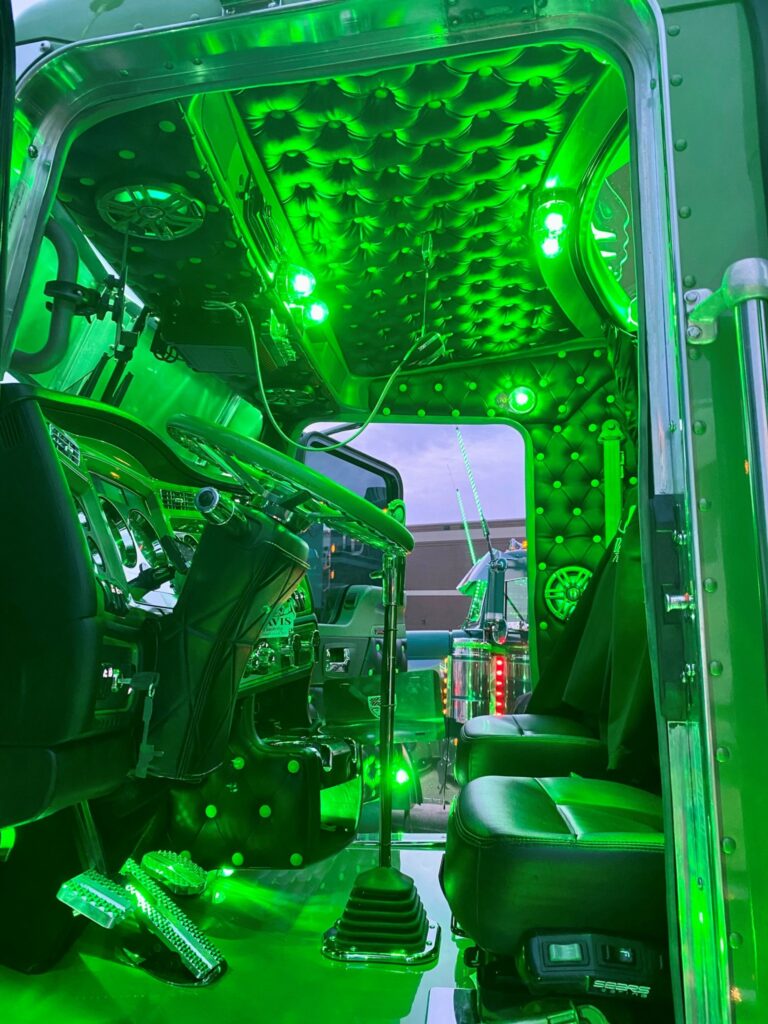A truck's interior bathed in green light