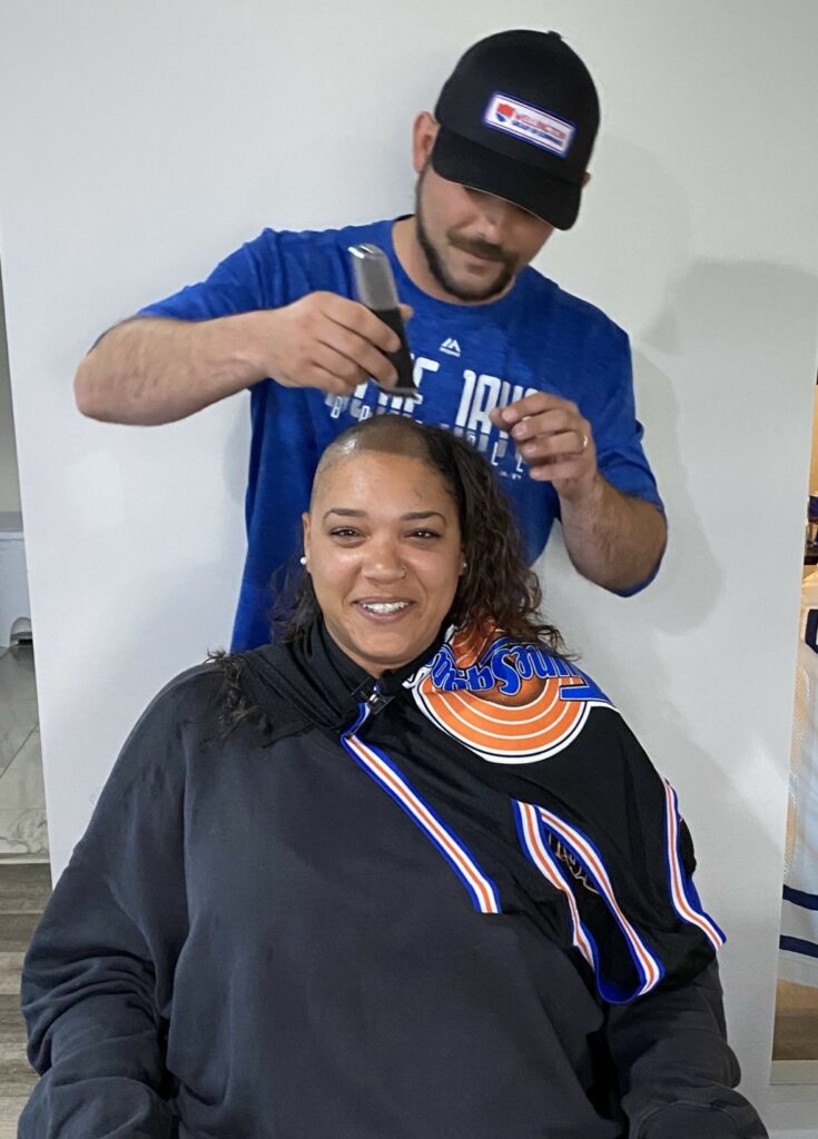 Woman getting head shaved
