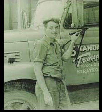 Picture of a man standing outside a truck