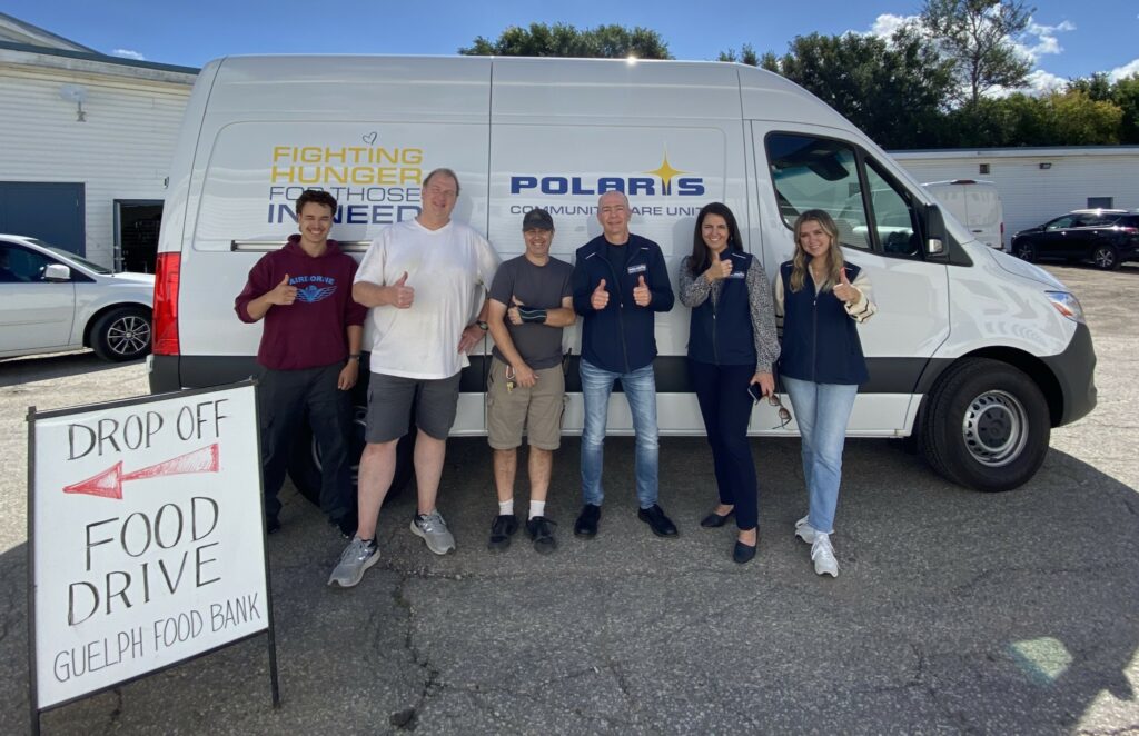 People stand in front of the Polaris Community Care Unit van