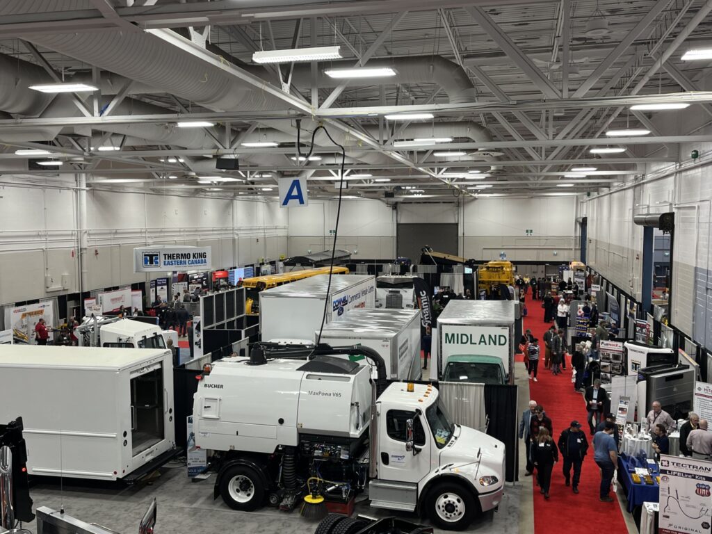 The image is of trucks at the 2022 Atlantic Transportation and Logistics Show.