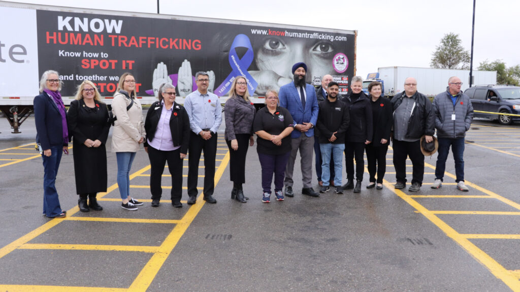 People standing in front of a trailer