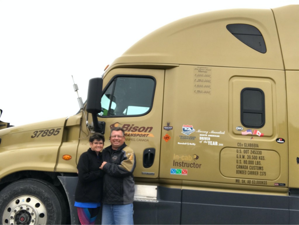 Murray Manuliak with his wife in front of the Bison Truck