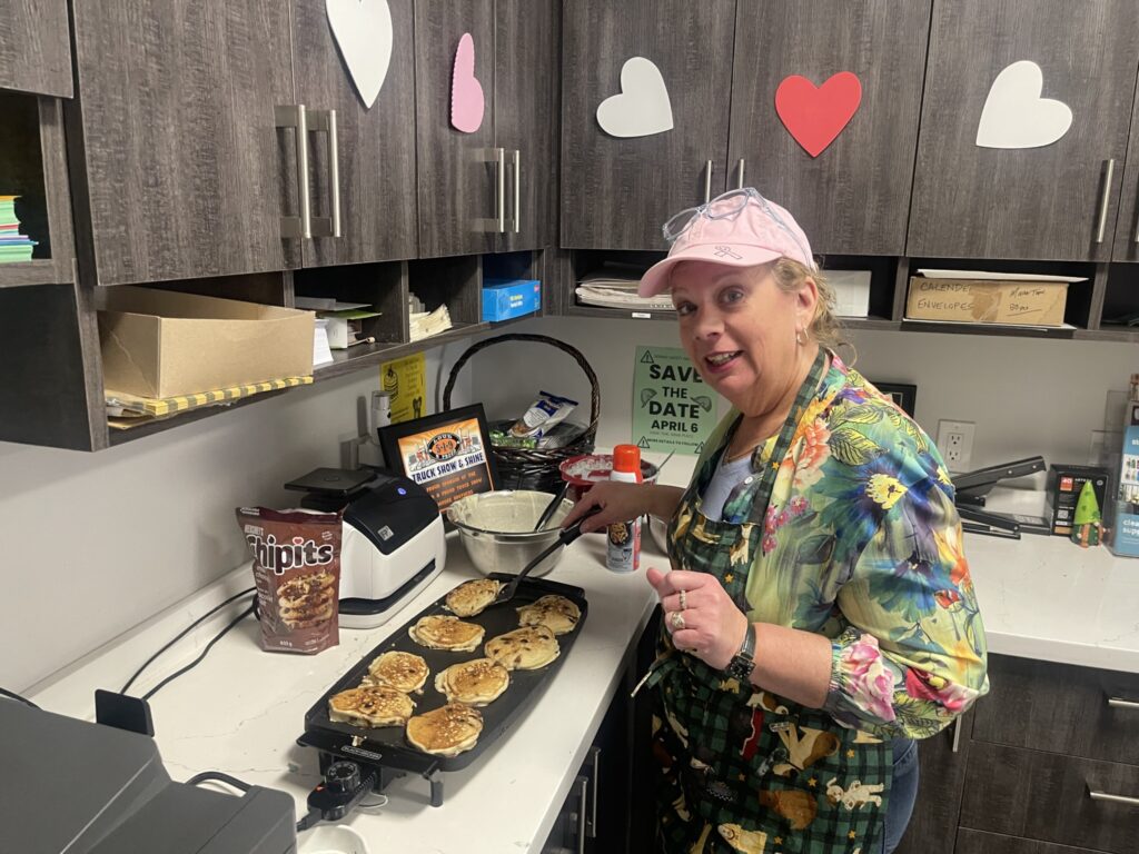 Sue Moore makes pancakes for staff