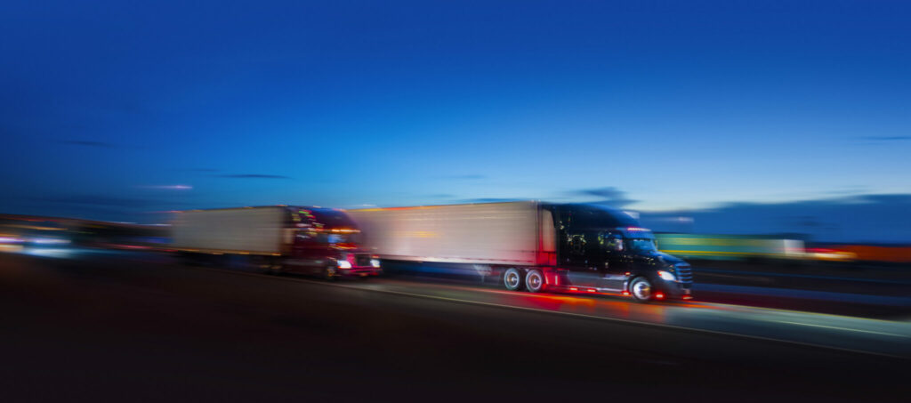 Picture of blurry trucks on the road