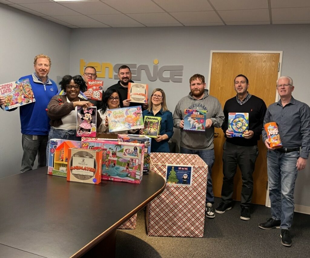 Displaying examples of some of the many toys collected by employees at Sister Companies Lily Transportation and Transervice Logistics Inc.